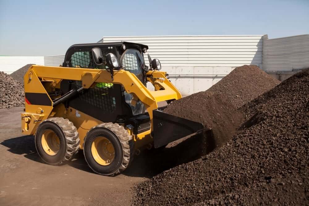Onsite photograph of wheel skid steer loader to get the job done with minimize cost and downtime.