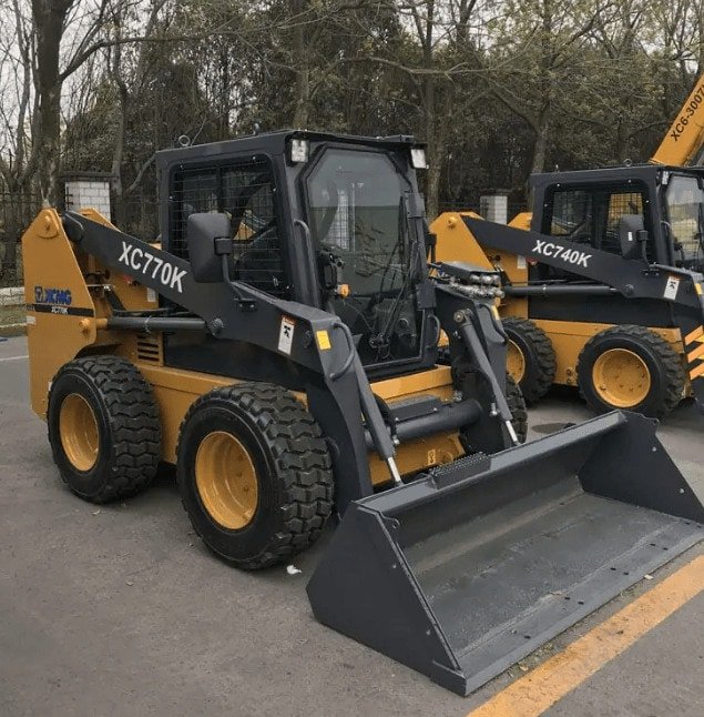 Photograph of wheeled skid steer loaders.