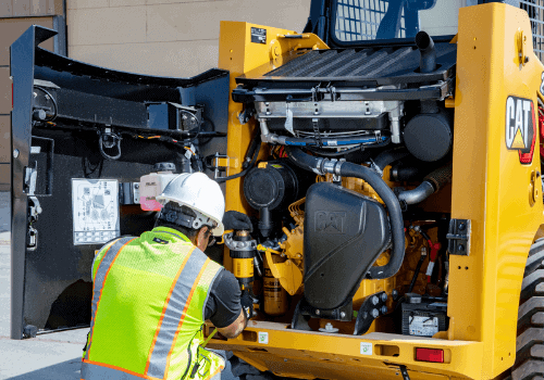 man maintaining China China Skid Steer Loaders