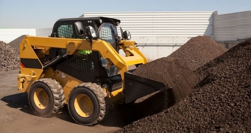 Yellow skid steer loader